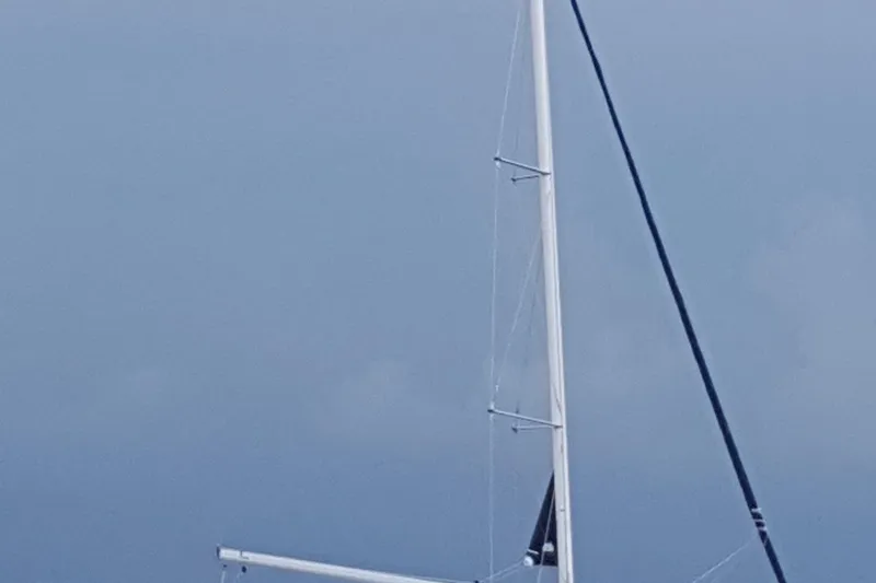 Slide: The Image of Sailboat with tall mast against cloudy sky, Hunter e 33, 2012 model. - 2