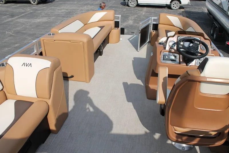 Slide: The Image of 2026 Avalon Venture Cruise Rear Bench 23 with tan and cream upholstery on a boat deck. - 11