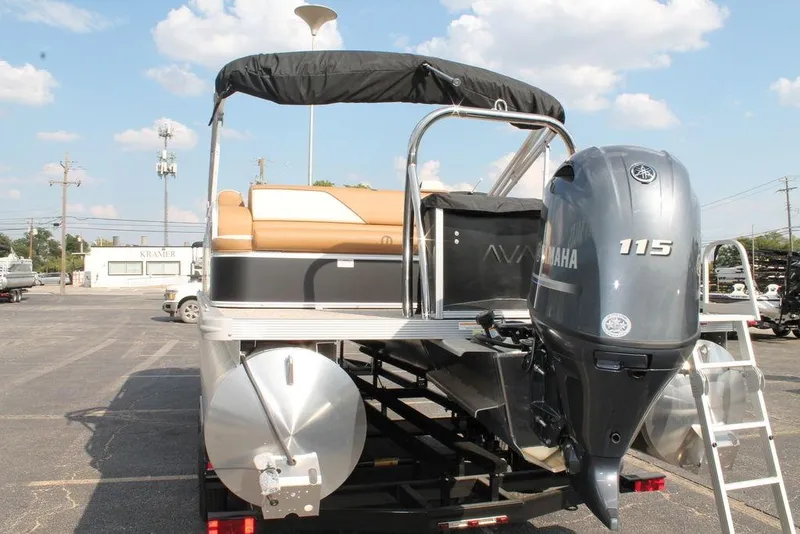 Slide: The Image of 2026 Avalon Venture Cruise Rear Bench 23 with Yamaha 115 engine, parked outdoors. - 4