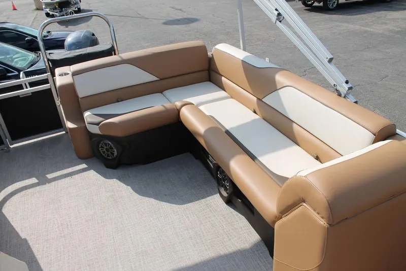 Slide: The Image of 2026 Avalon Venture Cruise Rear Bench 23 boat interior with steering wheel and captain's chair. - 6