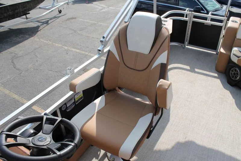 Slide: The Image of 2026 Avalon Venture Cruise Rear Bench 23 with tan and white seating on a boat. - 7