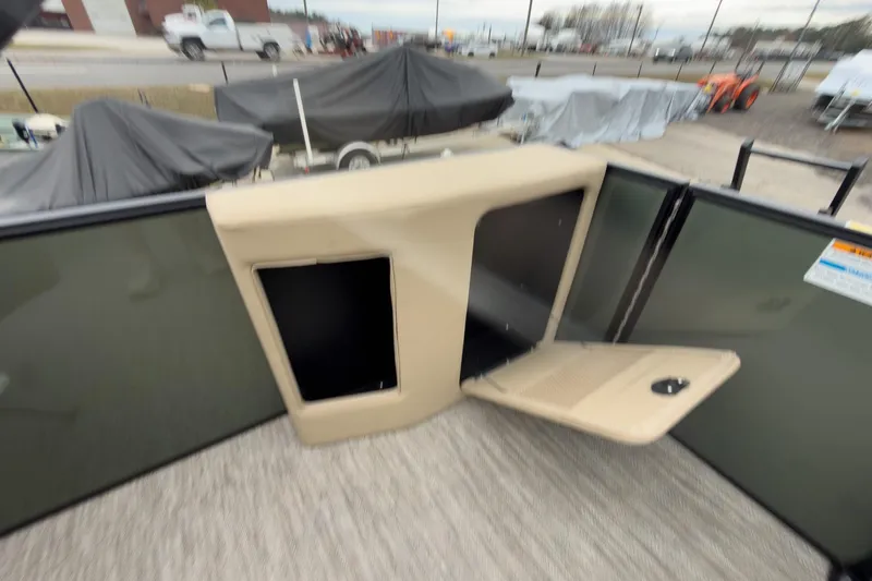 Slide: The Image of 2026 Godfrey Sweetwater Xperience 20' pontoon interior with storage compartment open. - 21