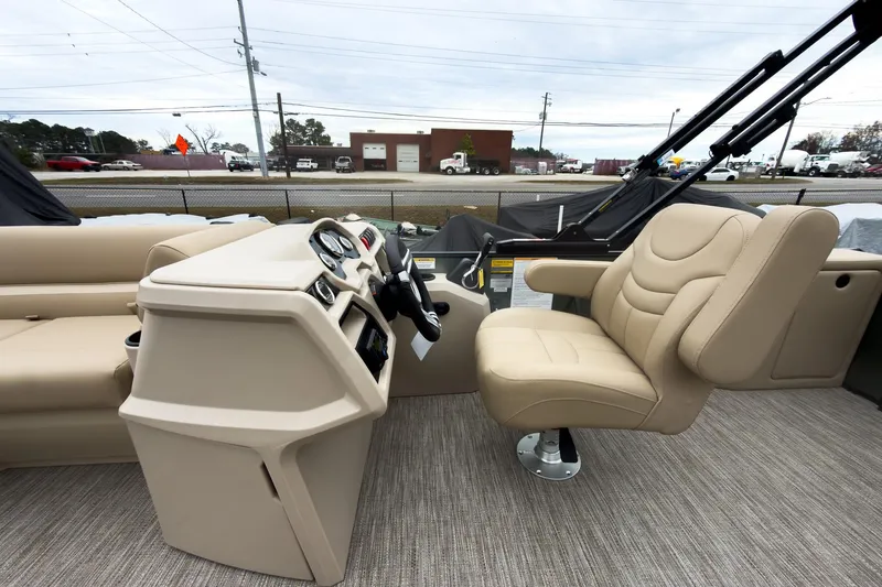 Slide: The Image of 2026 Godfrey Sweetwater Xperience 20' pontoon interior with beige captain's chair and console. - 6