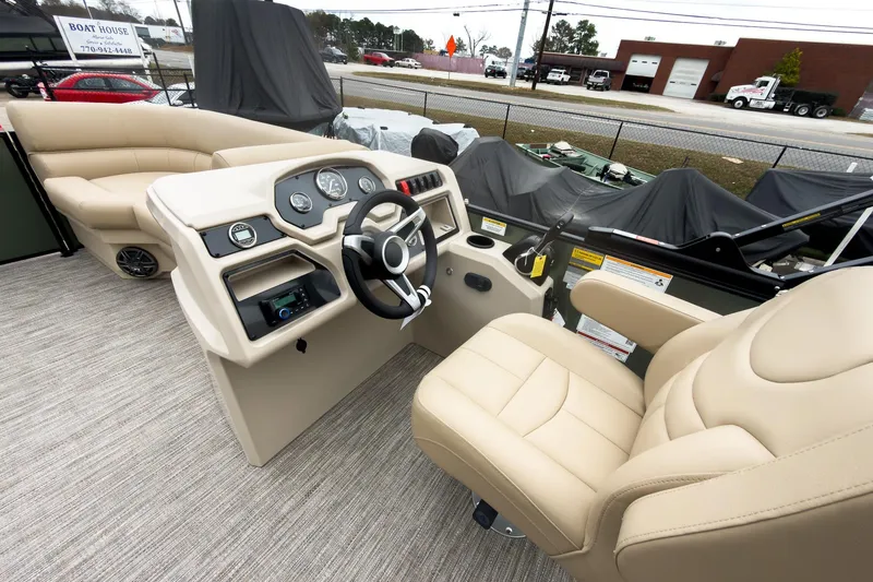 Slide: The Image of 2026 Godfrey Sweetwater Xperience 20' pontoon boat interior with beige seating and control panel. - 7
