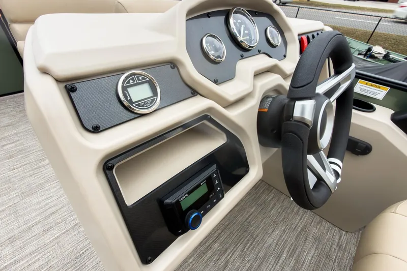 Slide: The Image of Steering console of 2026 Godfrey Sweetwater Xperience 20' Pontoon, featuring modern controls and gauges. - 9