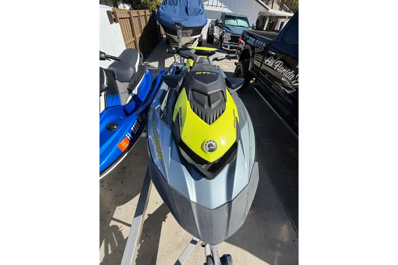 Slide: The Image of 2021 Sea-Doo GTI SE 130 jet ski in a driveway, vibrant yellow and gray design. - 17