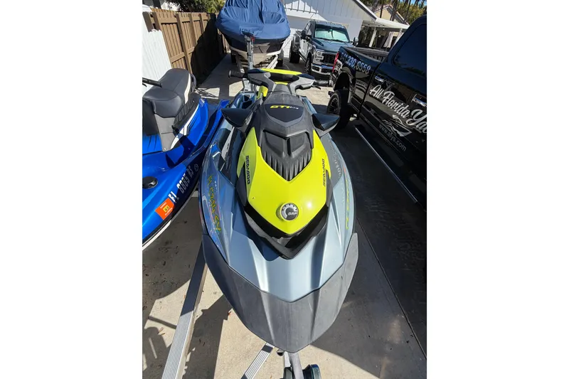 Slide: The Image of 2021 Sea-Doo GTI SE 130 jet ski parked on a trailer in a driveway. - 20