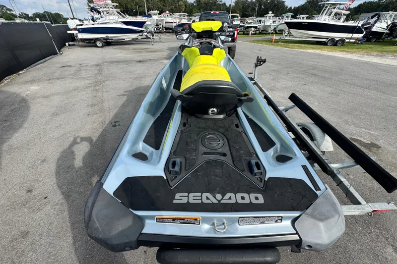 Slide: The Image of 2021 Sea-Doo GTI SE 130 on trailer, parked among boats in a marina. - 3
