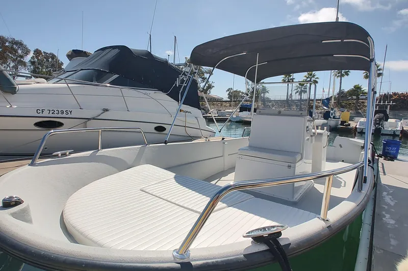 Slide: The Image of 2022 Duffy Bay Island boat docked in marina, featuring sleek design and spacious seating. - 7