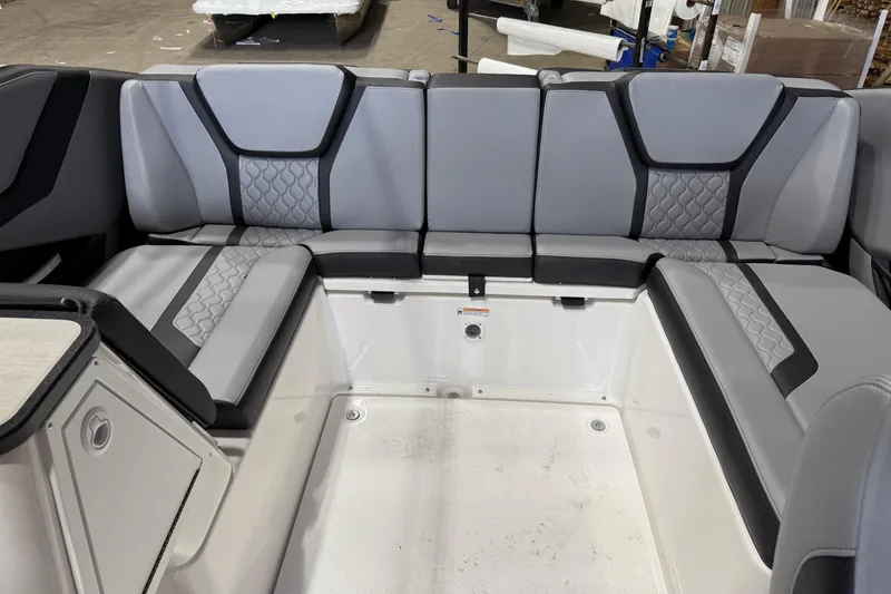 Slide: The Image of 2026 Yamaha Boats 255XE interior seating with modern gray upholstery design. - 4