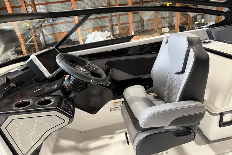 Slide: The Image of 2026 Yamaha Boats 255XE cockpit with modern steering and comfortable seating. - 6
