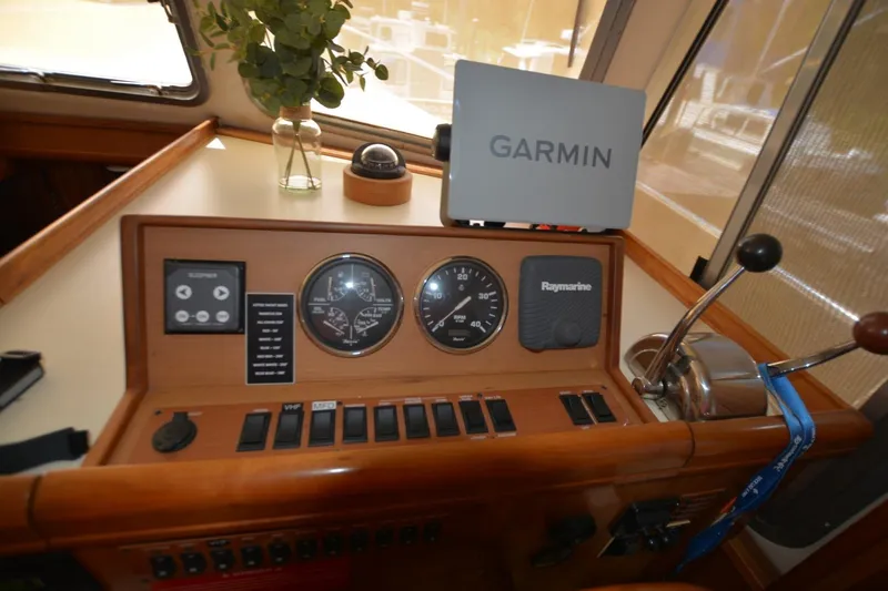 Slide: The Image of 2004 Mainship 400 Trawler helm with Garmin and Raymarine navigation equipment. - 12