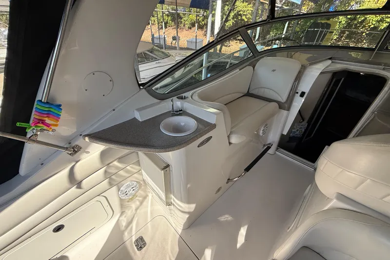 Slide: The Image of Interior of 2002 Four Winns 328 Vista boat with seating and sink area. - 18