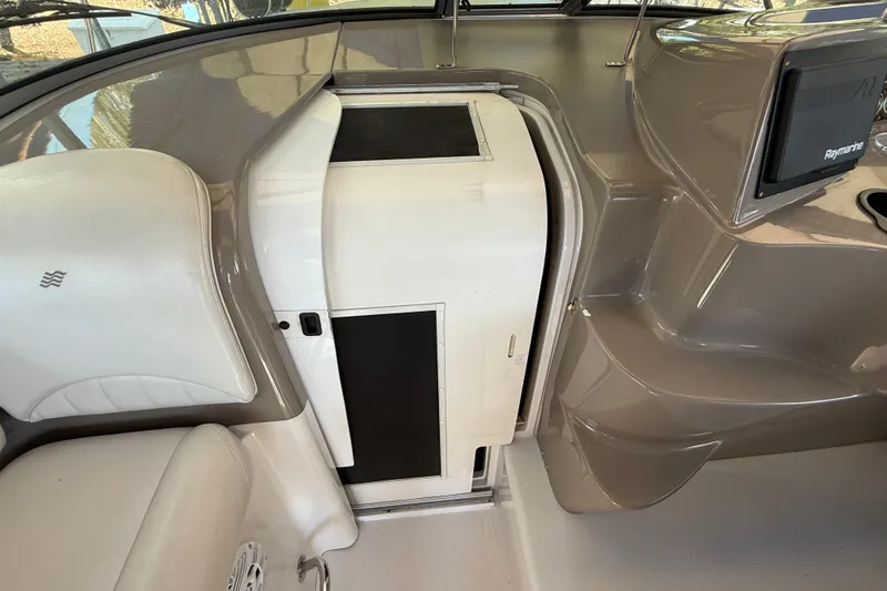 Slide: The Image of 2002 Four Winns 328 Vista boat interior with helm and seating area. - 23