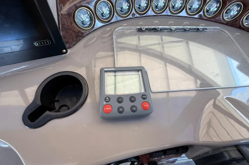 Slide: The Image of Control panel of a 2002 Four Winns 328 Vista boat with Raymarine display. - 27