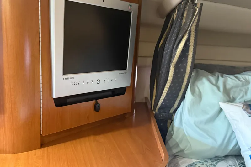 Slide: The Image of 2002 Four Winns 328 Vista cabin with Samsung TV and cozy bedding. - 40