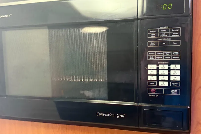 Slide: The Image of Microwave oven with convection grill in 2002 Four Winns 328 Vista boat kitchen. - 43
