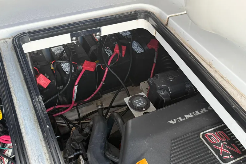 Slide: The Image of Engine compartment of a 2002 Four Winns 328 Vista boat, featuring Volvo Penta components. - 57