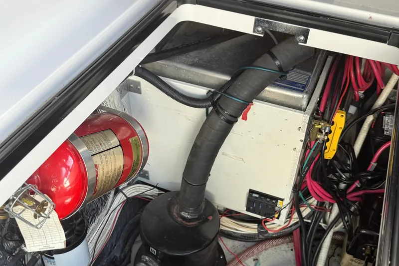 Slide: The Image of Engine compartment of 2002 Four Winns 328 Vista with fire extinguisher and wiring. - 58