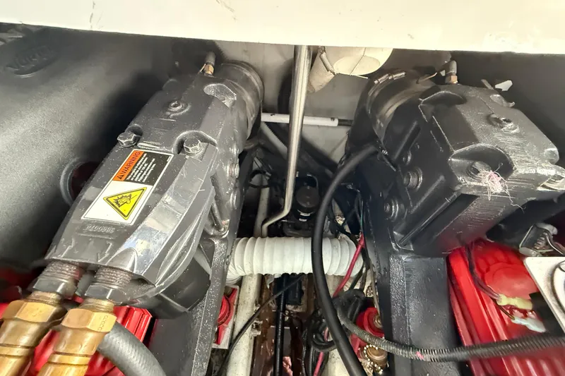 Slide: The Image of Engine compartment of 2002 Four Winns 328 Vista boat, showing mechanical components and wiring. - 60