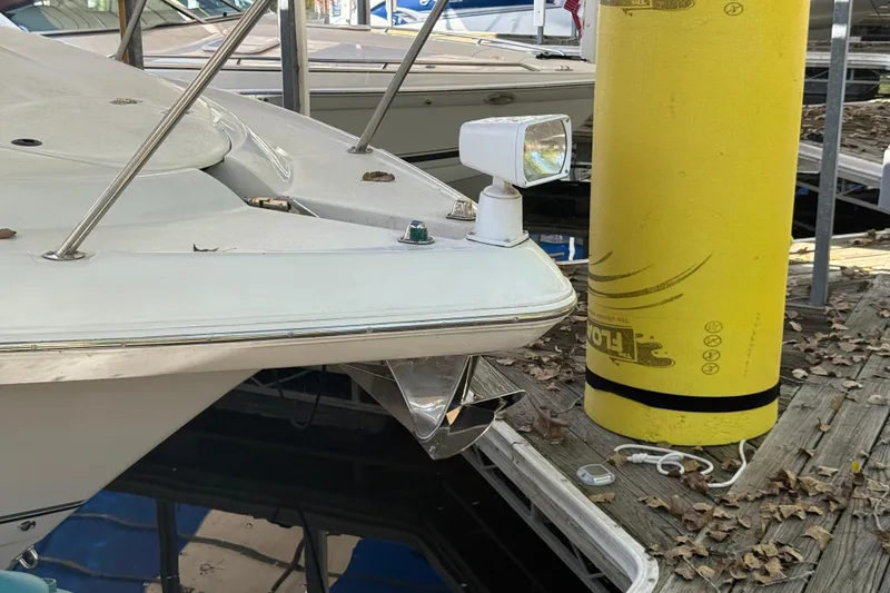 Slide: The Image of 2002 Four Winns 328 Vista boat docked with yellow buoy nearby. - 7