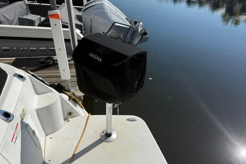 Slide: The Image of 2002 Four Winns 328 Vista boat with Magma grill cover at dockside. - 9