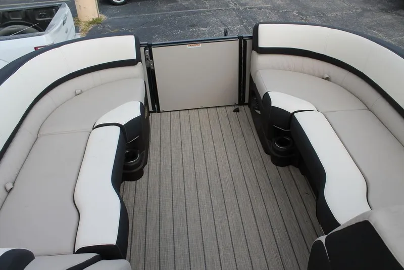 Slide: The Image of Interior of 2026 Avalon Catalina Cruise 23' boat with spacious seating and cup holders. - 12