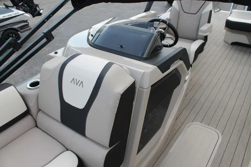 Slide: The Image of 2026 Avalon Catalina Cruise 23' boat interior with modern seating and steering console. - 7