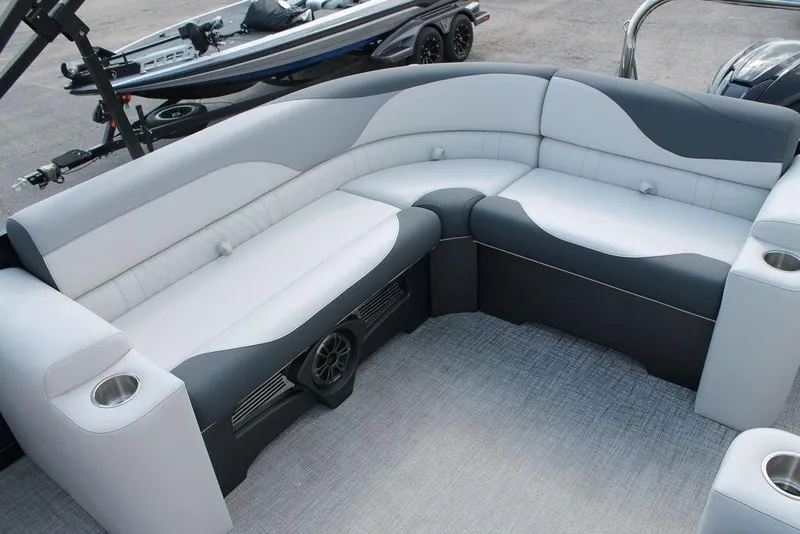 Slide: The Image of Luxurious seating on 2026 Avalon LSZ ELITE - 23 pontoon boat, featuring sleek design and cup holders. - 10