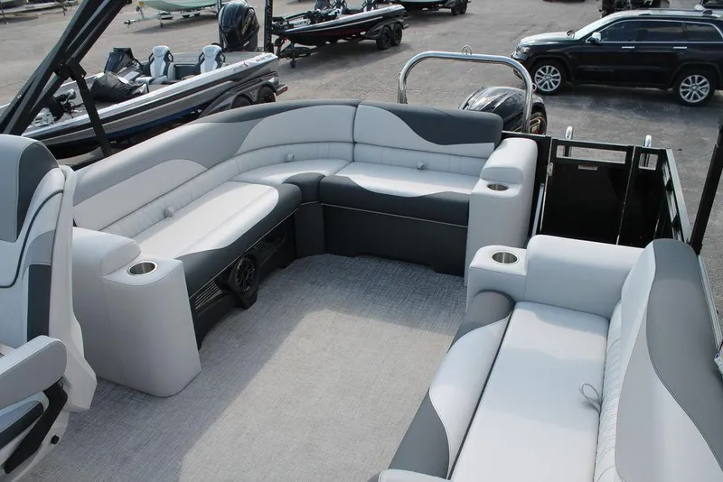 Slide: The Image of 2026 Avalon LSZ ELITE - 23 pontoon boat interior with luxurious seating and cup holders. - 13