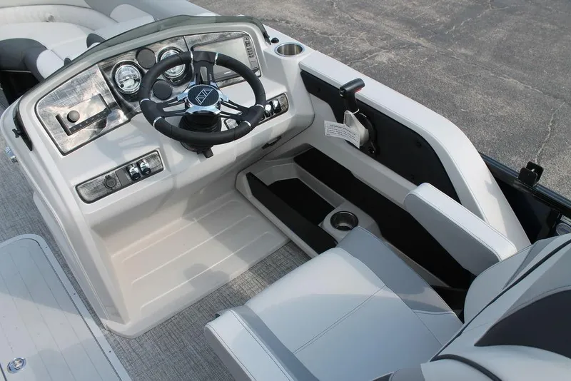 Slide: The Image of 2026 Avalon LSZ ELITE - 23 boat cockpit with modern steering and controls. - 14