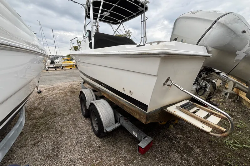 Slide: The Image of 1999 Wellcraft 22 Coastal Walkaround O/B boat on trailer, parked outdoors. - 6
