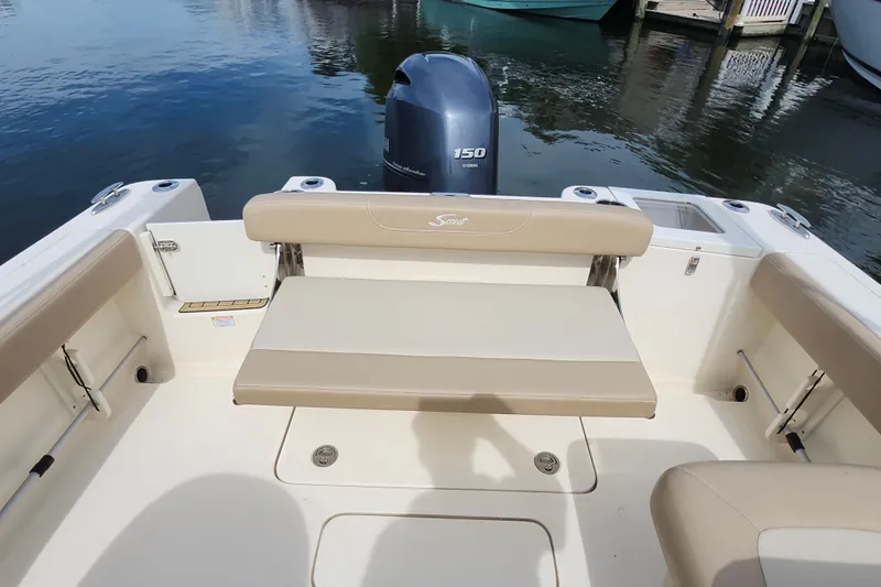 Slide: The Image of 2022 Scout 215 Dorado boat interior with seating and Yamaha 150 engine. - 13