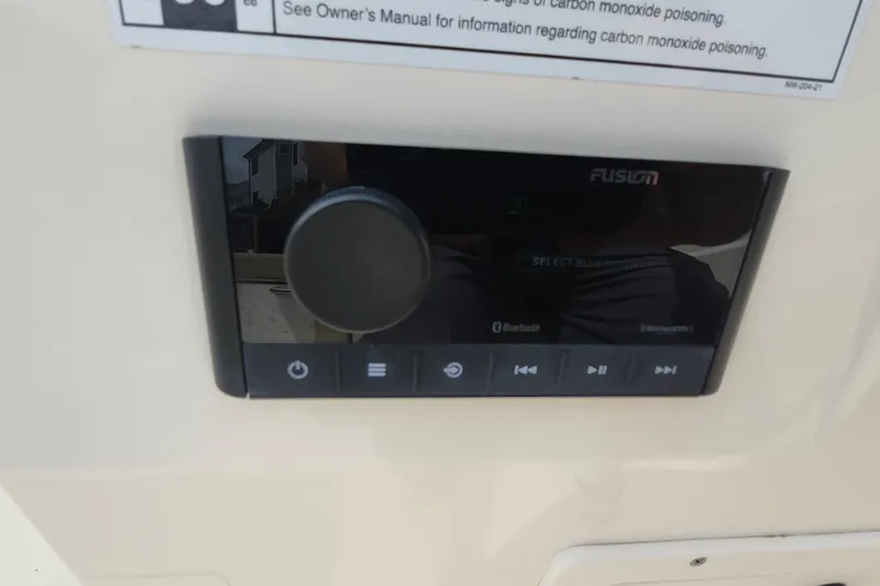 Slide: The Image of 2022 Scout 215 Dorado boat stereo system with Bluetooth connectivity and control panel. - 18