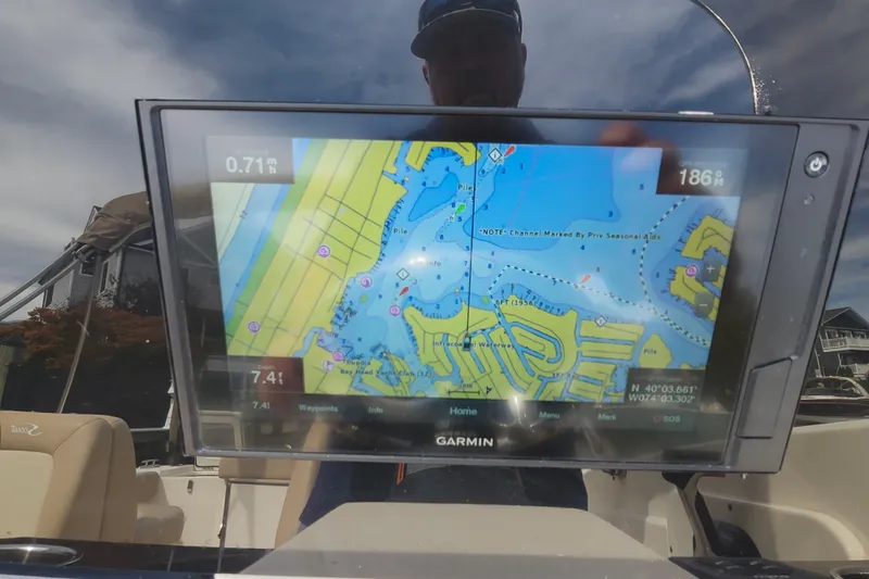 Slide: The Image of Garmin navigation display on 2022 Scout 215 Dorado boat, showing nautical map. - 19