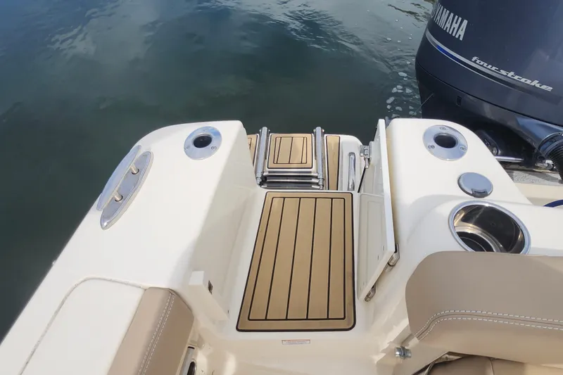 Slide: The Image of 2022 Scout 215 Dorado boat with Yamaha engine, featuring swim platform and ladder. - 20