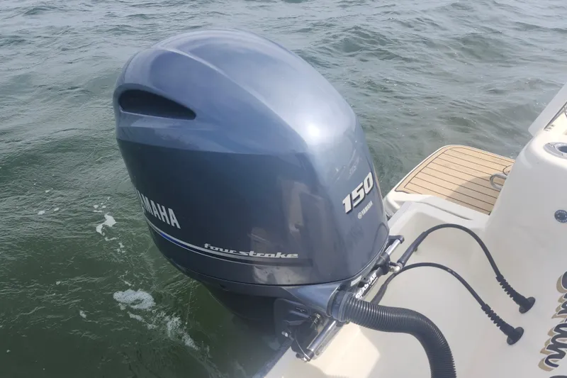 Slide: The Image of Yamaha 150 four-stroke outboard motor on 2022 Scout 215 Dorado boat. - 23