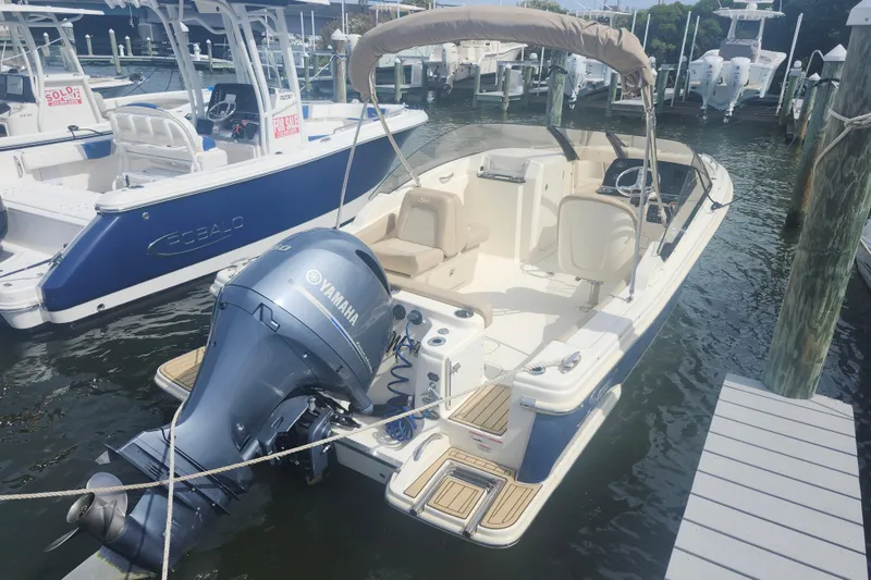 Slide: The Image of 2022 Scout 215 Dorado boat with Yamaha engine docked at marina. - 3
