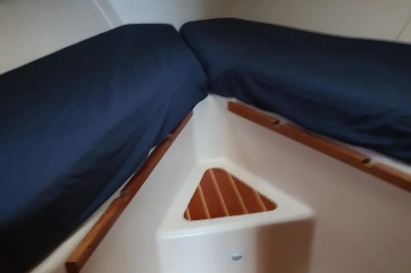 Slide: The Image of Interior cabin of 2003 Mainship 34 PILOT with twin beds and wooden accents. - 19