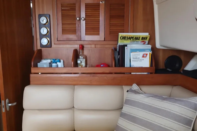 Slide: The Image of Interior of 2003 Mainship 34 PILOT with wooden cabinetry and nautical decor. - 25