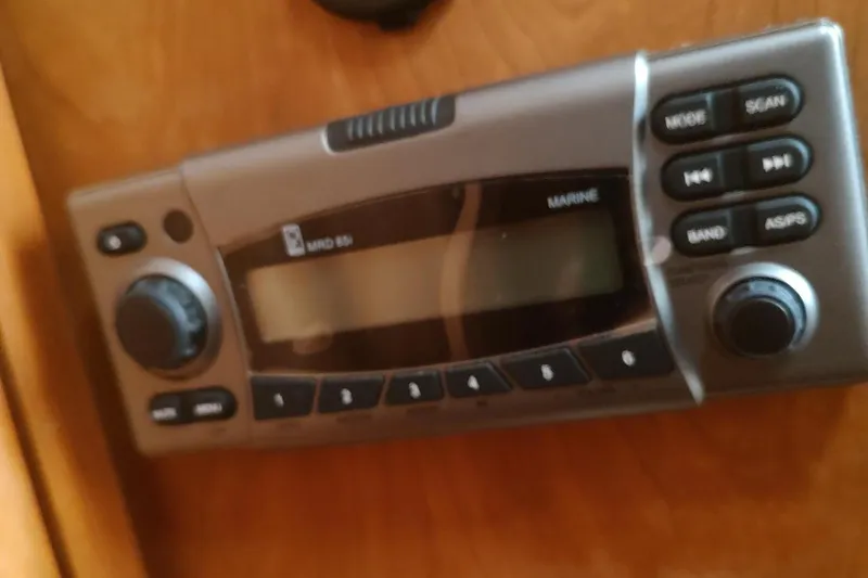 Slide: The Image of Marine radio system on 2003 Mainship 34 PILOT boat dashboard. - 33