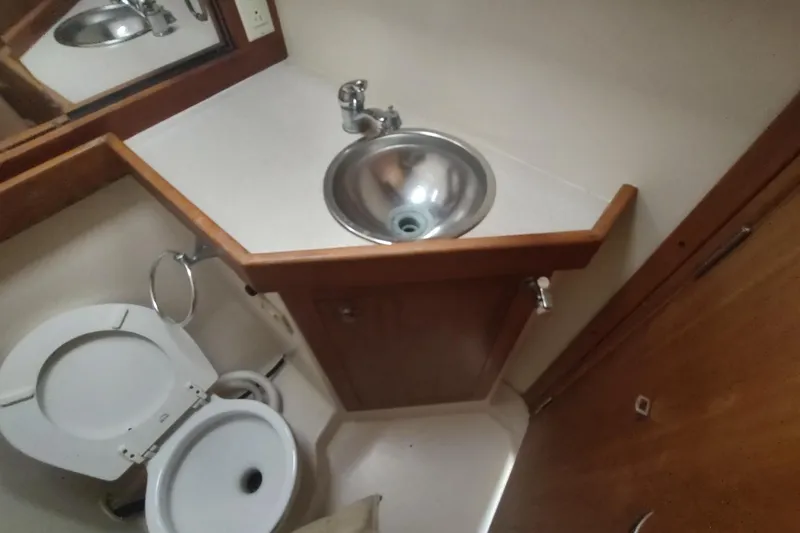 Slide: The Image of 2003 Mainship 34 PILOT bathroom with sink and toilet. - 36