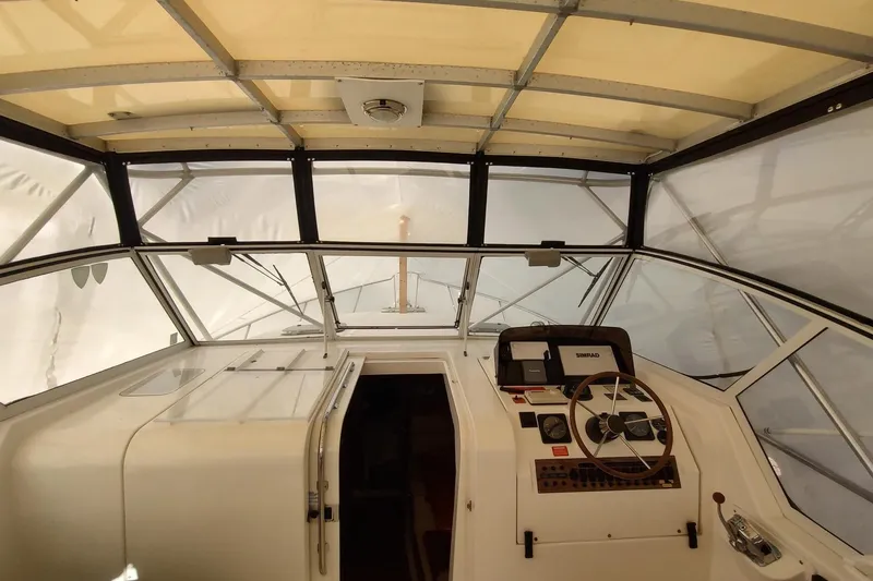 Slide: The Image of 2003 Mainship 34 PILOT boat interior with steering wheel and navigation equipment. - 37