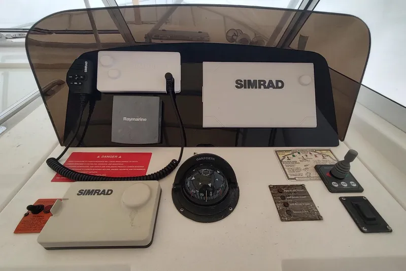 Slide: The Image of Control panel of a 2003 Mainship 34 PILOT boat with navigation equipment. - 44