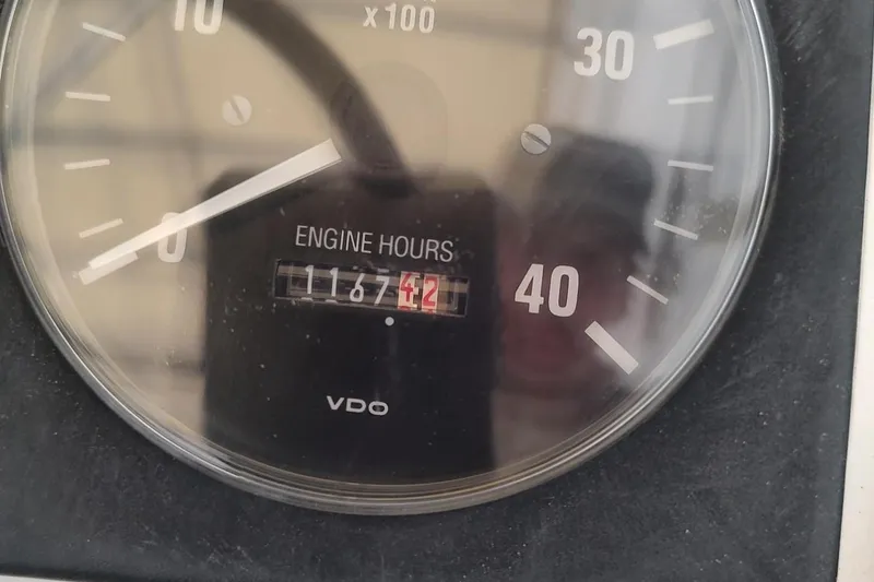 Slide: The Image of Close-up of a VDO engine hour meter showing 1167.42 hours on a 2003 Mainship 34 PILOT. - 47
