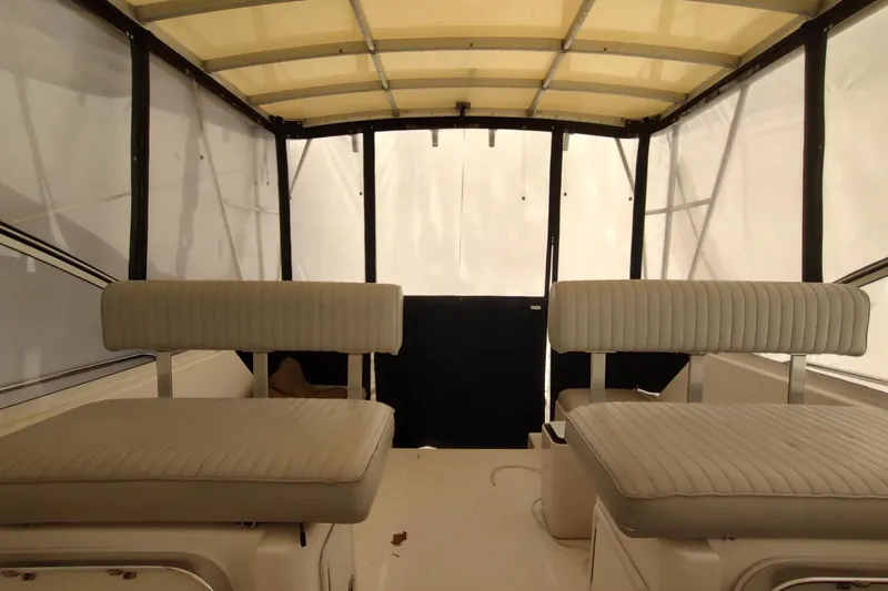 Slide: The Image of 2003 Mainship 34 PILOT interior with cushioned seating and canopy. - 50