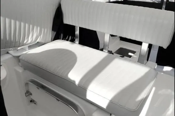 Slide: The Image of 2003 Mainship 34 PILOT boat interior with white cushioned seating and sleek design. - 53