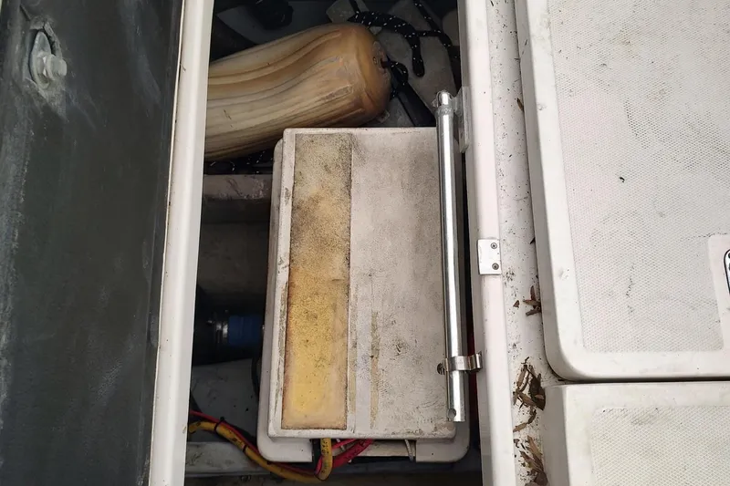 Slide: The Image of Storage compartment of a 2003 Mainship 34 PILOT boat, showing equipment and accessories. - 61