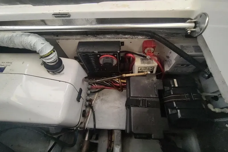 Slide: The Image of Engine compartment of 2003 Mainship 34 PILOT with battery switch and wiring. - 64