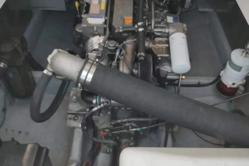 Slide: The Image of Engine compartment of a 2003 Mainship 34 PILOT boat, showcasing mechanical components. - 67